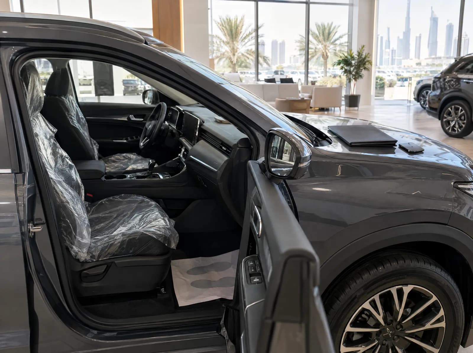A new SUV in a dealership showroom before purchase